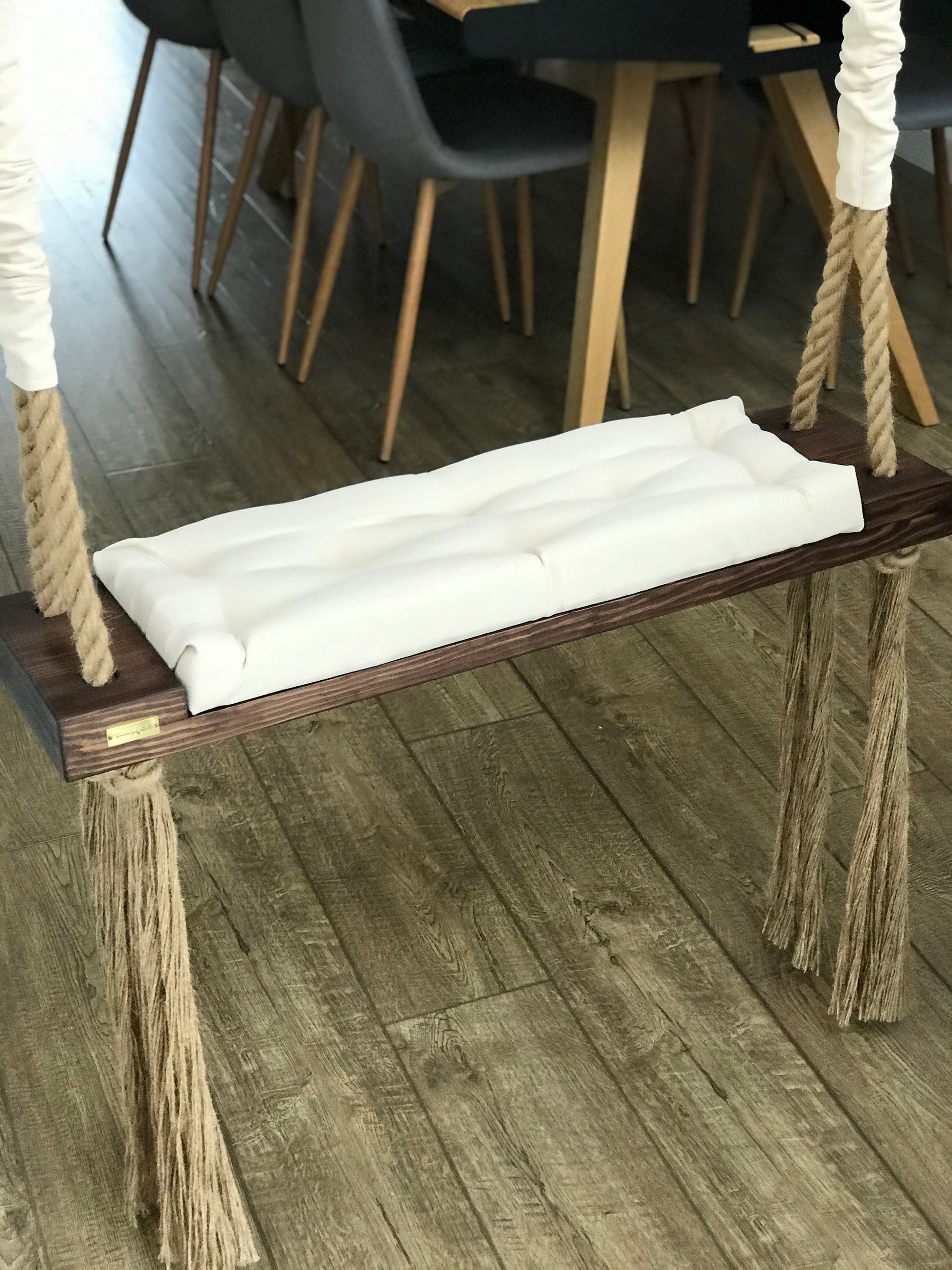 dark oak wooden swing seat with cream cushion