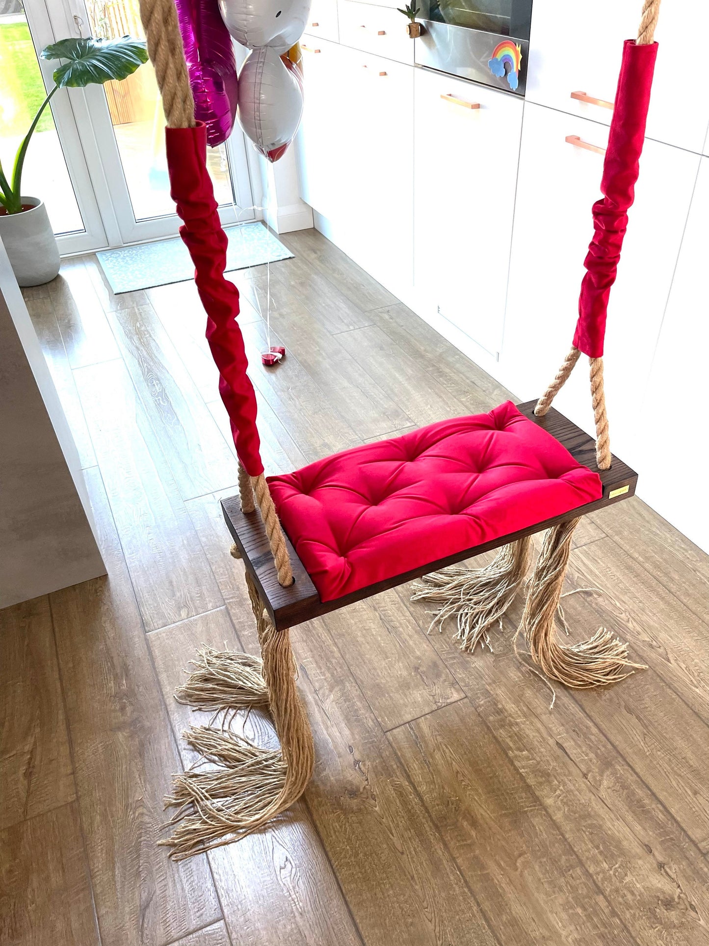 wooden walnut swing chair with red velvet pillow